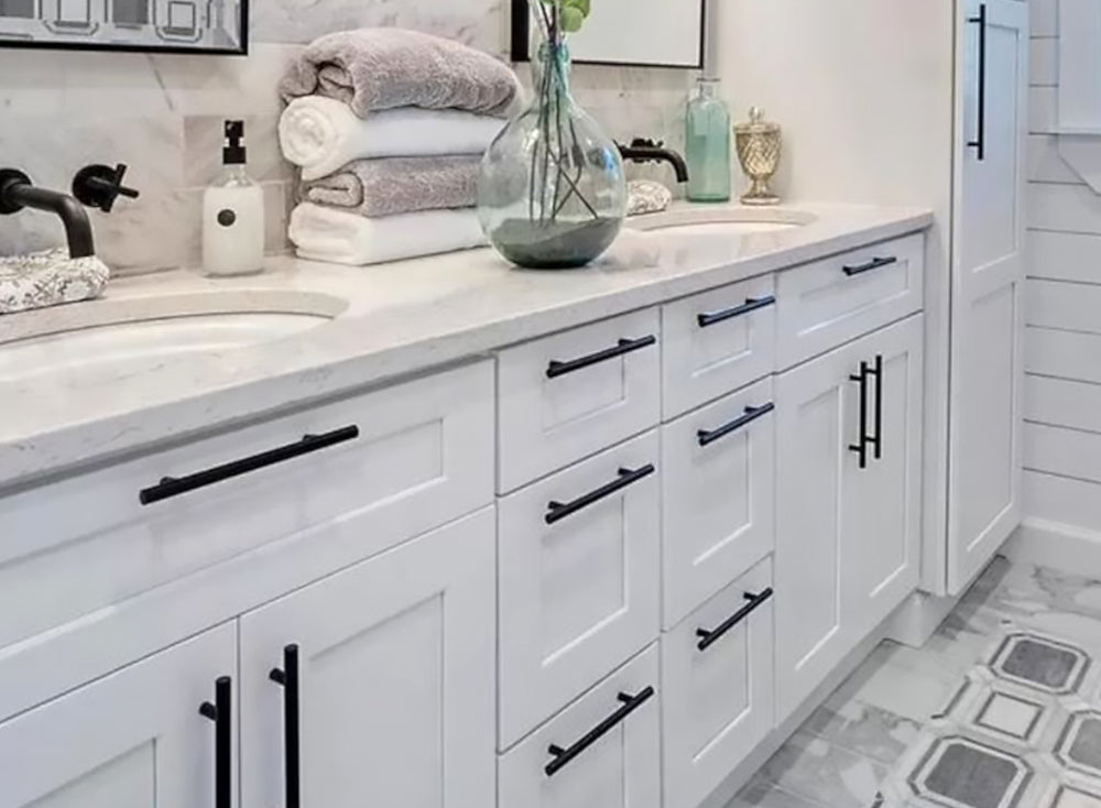 white shaker cabinets in kitchen with black shaker island